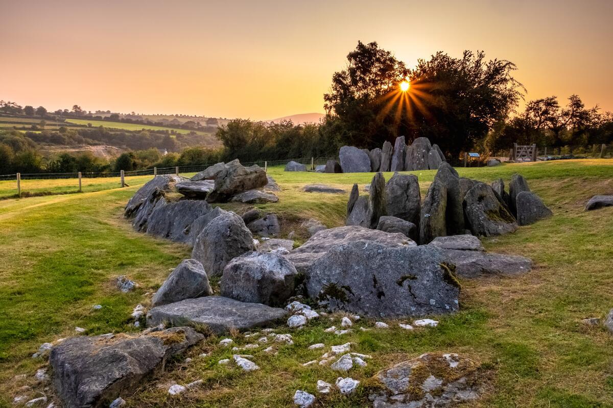 Sunset over a megalithic tomb in Ireland's Hidden Heartlands